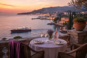 South of France terrace scene featuring a romantic table for two, rosé, champagne glasses, lavender, sunset coastal views, yachts, and a luxury French Riviera atmosphere